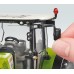 Игрушка трактор Claas Arion 650 с погрузчиком title=