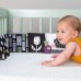 Розвивальна іграшка Taf Toys Книжка-розкладушка Садочок у місті Зайчики, м'яка (13065) title=
