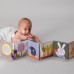 Розвивальна іграшка Taf Toys Книжка-розкладушка Садочок у місті Зайчики, м'яка (13065) title=