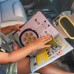 Развивающая игрушка Taf Toys Книжка путешественника для авто, мягкая (13825) title=